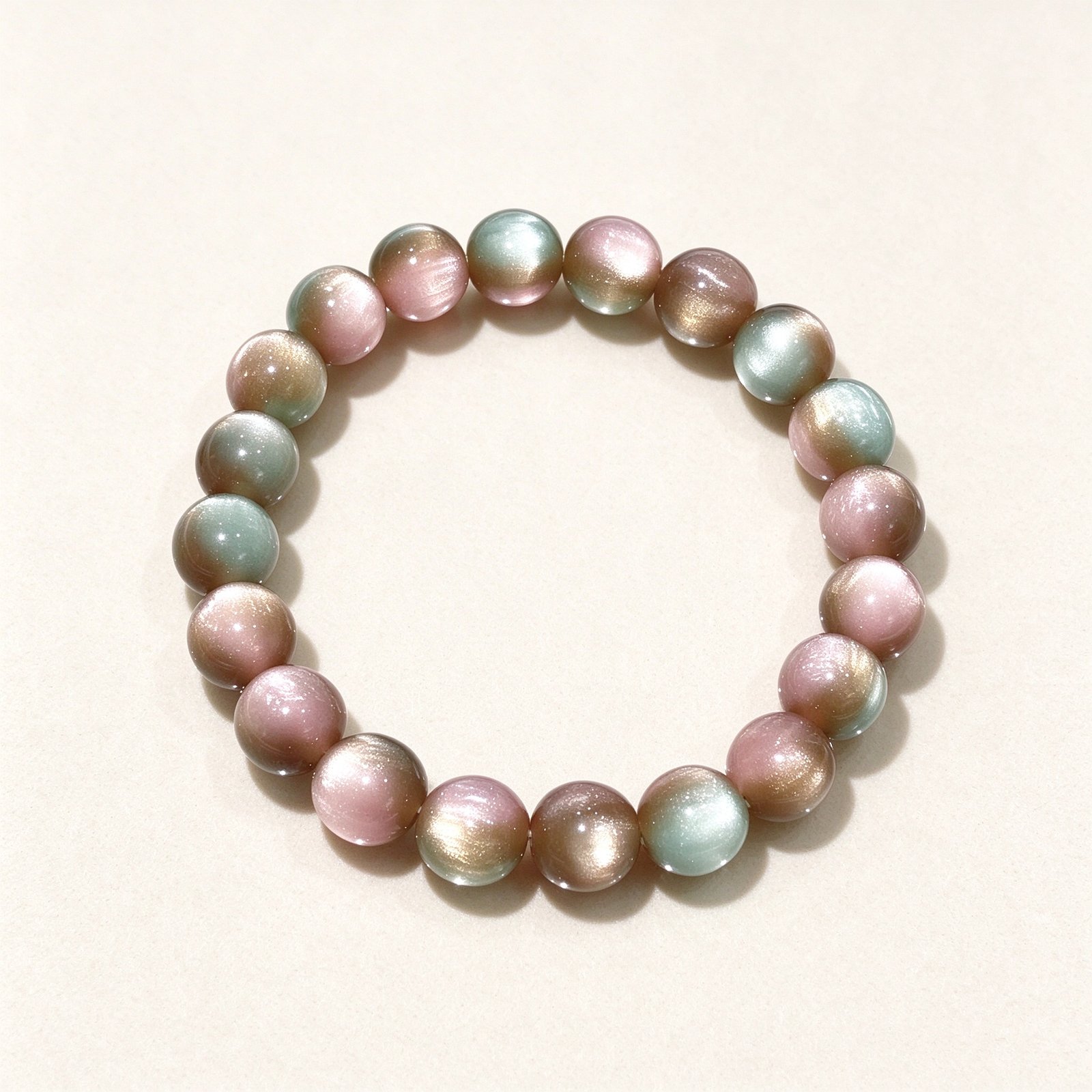 Multicolor cat's eye feng shui bracelet with rainbow crystal beads on cream white background